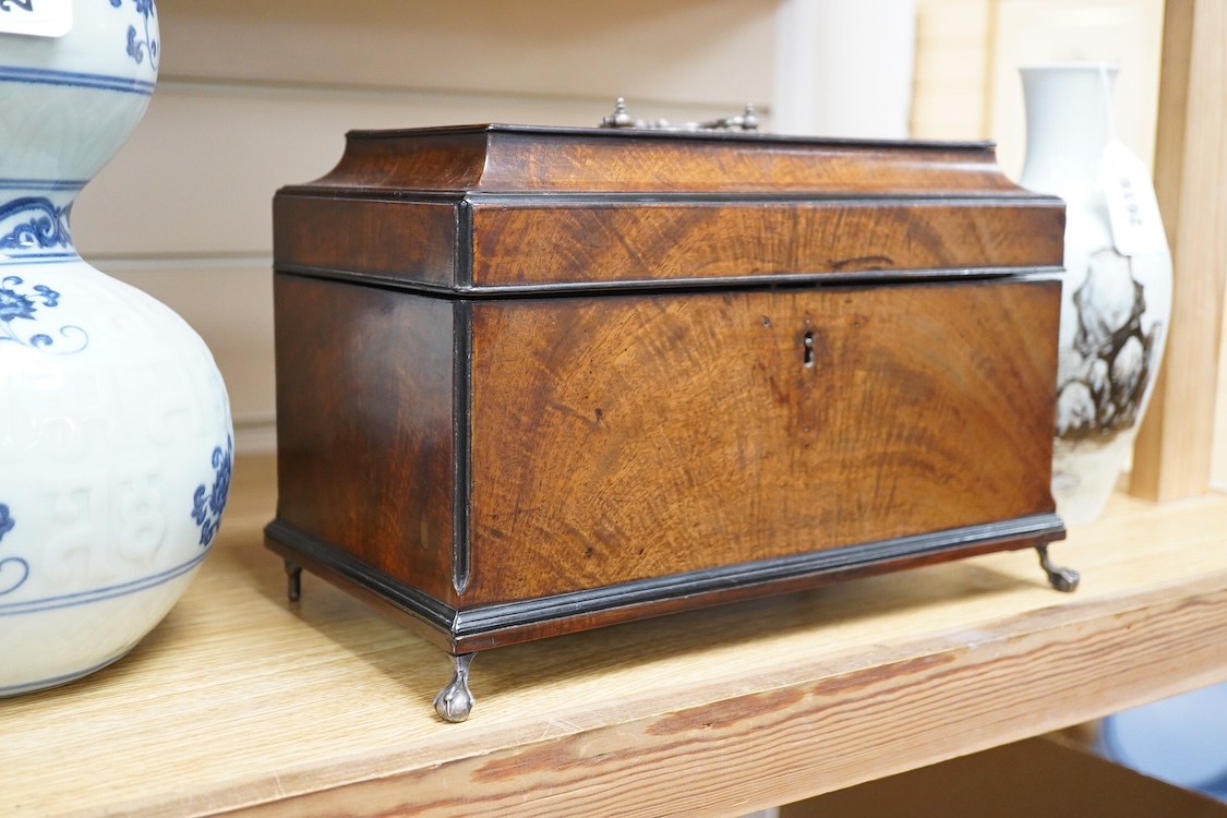 A George III and later flame mahogany veneered writing box raised on ball feet, 30cm wide